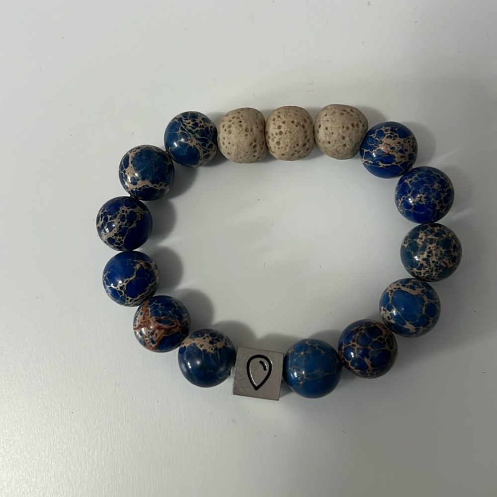 Essential oil bracelet with three beads to absorb essential oils